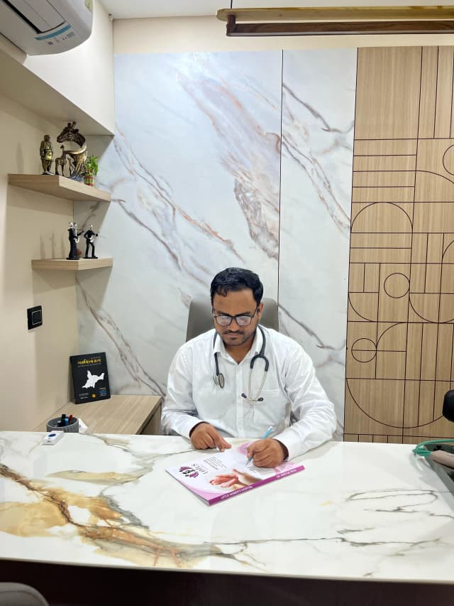 Doctor Writing at Desk